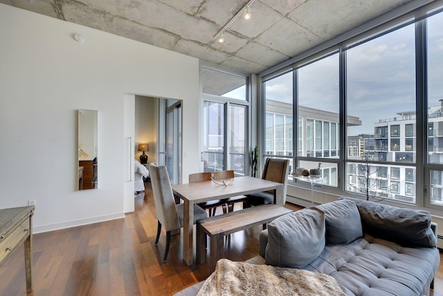 901 2nd St Unit 905, Minneapolis, MN 55415 - dining space with wood finished floors, track lighting, baseboards, and baseboard heating