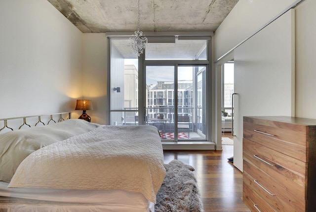 901 2nd St Unit 905, Minneapolis, MN 55415 - bedroom with wood finished floors, floor to ceiling windows, a chandelier, and access to outside