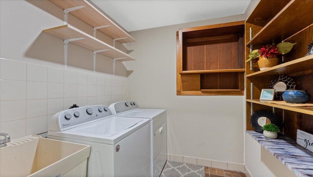 9803 287th Ave NW, Zimmerman, MN 55398 - washroom with washer and clothes dryer and baseboards
