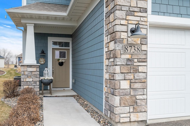 8738 Upper 9th Pl N, Lake Elmo, MN 55042 - doorway to property with roof with shingles and stone siding