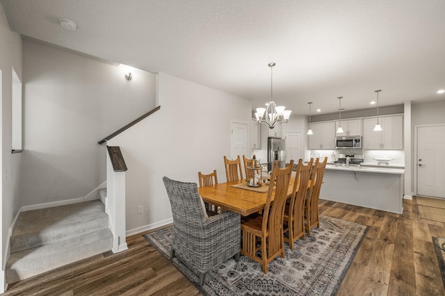 8738 Upper 9th Pl N, Lake Elmo, MN 55042 - dining room with dark wood-type flooring, recessed lighting, a chandelier, baseboards, and stairs