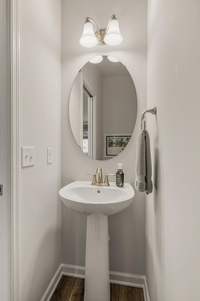 8738 Upper 9th Pl N, Lake Elmo, MN 55042 - bathroom with baseboards, wood finished floors, and a sink