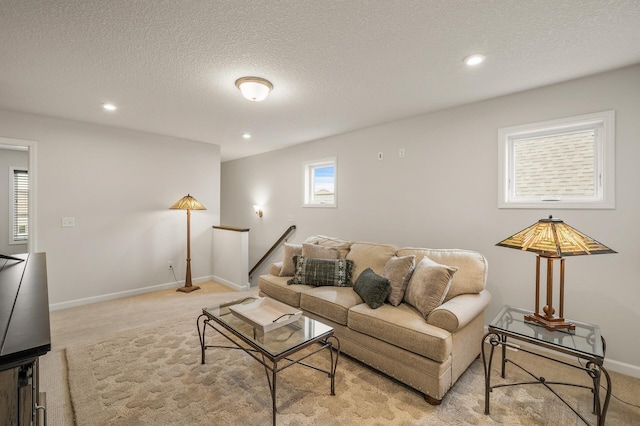 8738 Upper 9th Pl N, Lake Elmo, MN 55042 - living room featuring light colored carpet, a textured ceiling, recessed lighting, and baseboards
