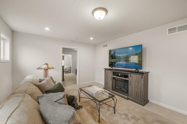 8738 Upper 9th Pl N, Lake Elmo, MN 55042 - living room featuring light colored carpet, a fireplace, recessed lighting, baseboards, and a textured ceiling