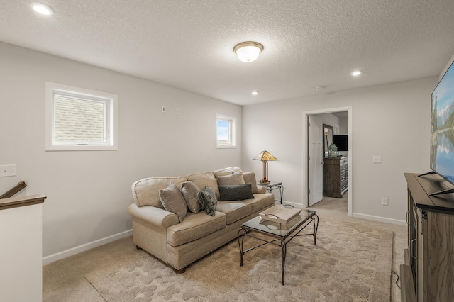 8738 Upper 9th Pl N, Lake Elmo, MN 55042 - living area with light colored carpet, a textured ceiling, recessed lighting, and baseboards