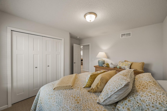 8738 Upper 9th Pl N, Lake Elmo, MN 55042 - carpeted bedroom with a closet and a textured ceiling