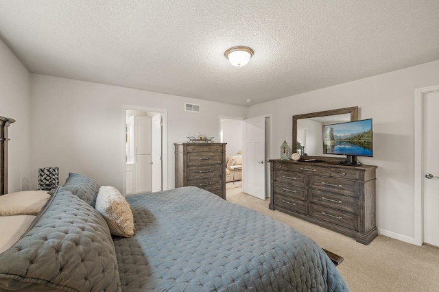8738 Upper 9th Pl N, Lake Elmo, MN 55042 - bedroom with light colored carpet, a textured ceiling, baseboards, and connected bathroom