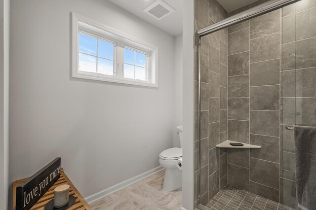8738 Upper 9th Pl N, Lake Elmo, MN 55042 - bathroom with toilet, a shower stall, and baseboards