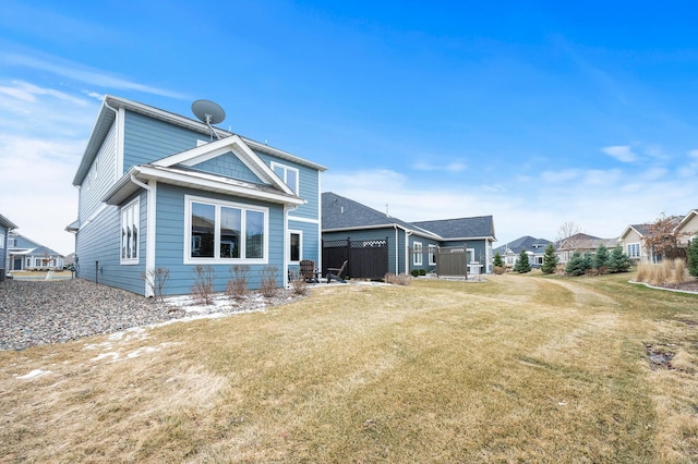 8738 Upper 9th Pl N, Lake Elmo, MN 55042 - rear view of house with a lawn