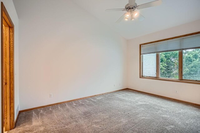1584 126th Ln NW, Coon Rapids, MN 55448 - spare room with carpet flooring, vaulted ceiling, and ceiling fan