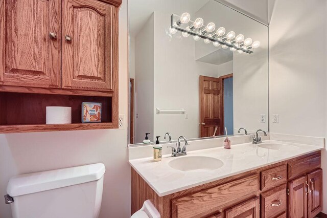 1584 126th Ln NW, Coon Rapids, MN 55448 - bathroom with toilet and double vanity