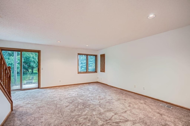 1584 126th Ln NW, Coon Rapids, MN 55448 - carpeted spare room with recessed lighting