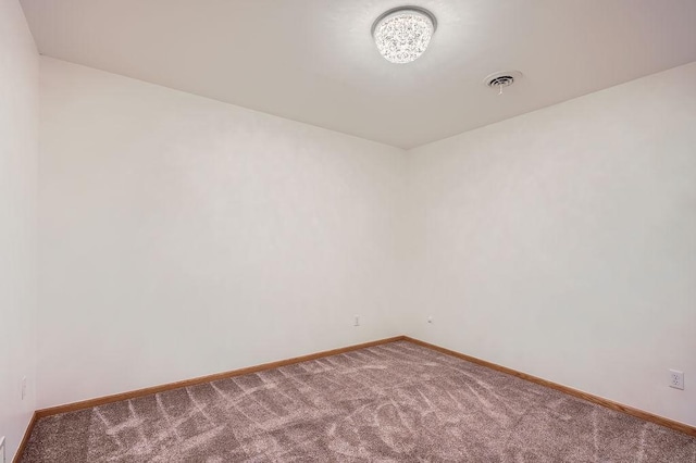 1584 126th Ln NW, Coon Rapids, MN 55448 - spare room with carpet and baseboards