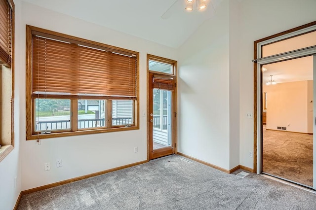 1584 126th Ln NW, Coon Rapids, MN 55448 - carpeted spare room with vaulted ceiling and a ceiling fan