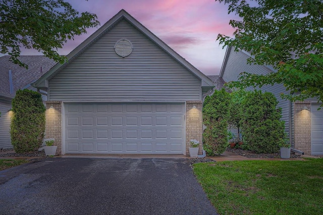 1584 126th Ln NW, Coon Rapids, MN 55448 - garage featuring driveway