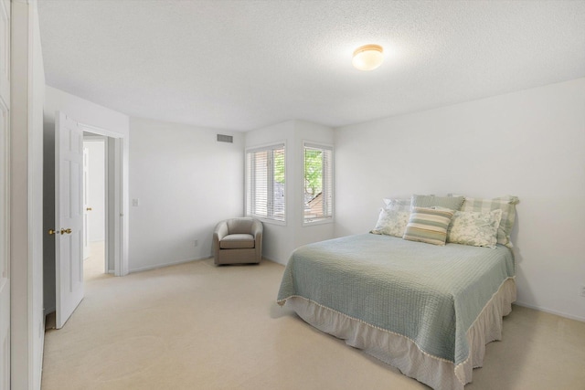5555 70th St, Edina, MN 55439 - carpeted bedroom featuring a textured ceiling and baseboards