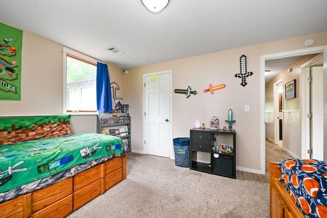 15607 93rd Cir NE, Otsego, MN 55330 - carpeted bedroom featuring a textured ceiling and baseboards