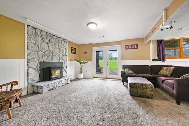 15607 93rd Cir NE, Otsego, MN 55330 - carpeted living area with wainscoting, a textured ceiling, and french doors
