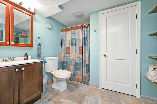 15607 93rd Cir NE, Otsego, MN 55330 - full bathroom featuring vanity, toilet, baseboards, a textured ceiling, and stone finish floors