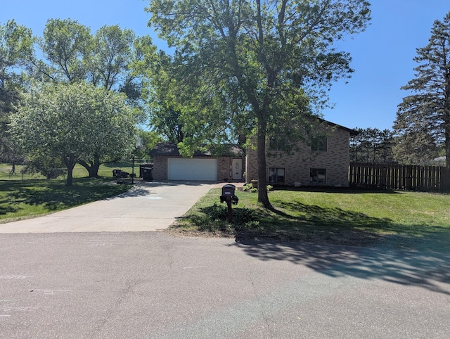 15607 93rd Cir NE, Otsego, MN 55330 - view of front facade featuring driveway, brick siding, and an attached garage