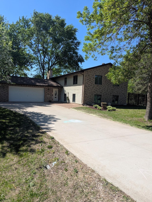 15607 93rd Cir NE, Otsego, MN 55330 - tri-level home with driveway, a garage, and brick siding
