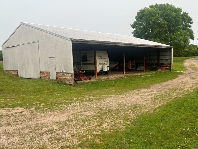 4365 40th St SW, Marysville Twp, MN 55390 - view of pole building featuring a lawn and a carport