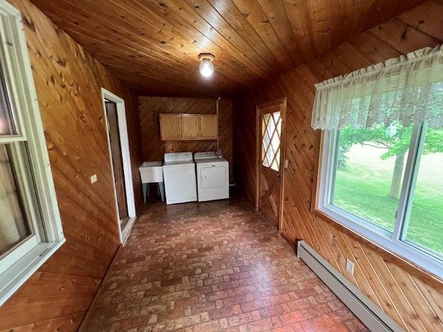4365 40th St SW, Marysville Twp, MN 55390 - laundry room featuring a baseboard radiator, cabinet space, independent washer and dryer, brick floors, and wooden walls