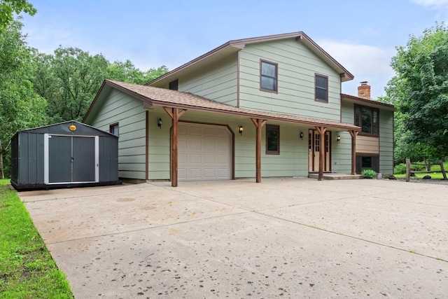 24345 165th St NW, Orrock Twp, MN 55309 - split level home featuring a storage shed, an attached garage, concrete driveway, and a chimney