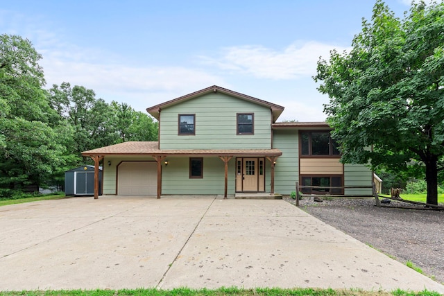 24345 165th St NW, Orrock Twp, MN 55309 - tri-level home with a shed, an attached garage, covered porch, and concrete driveway