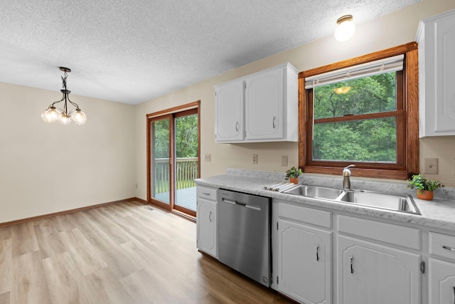 24345 165th St NW, Orrock Twp, MN 55309 - kitchen with stainless steel dishwasher, a textured ceiling, light wood-style flooring, white cabinets, and light countertops