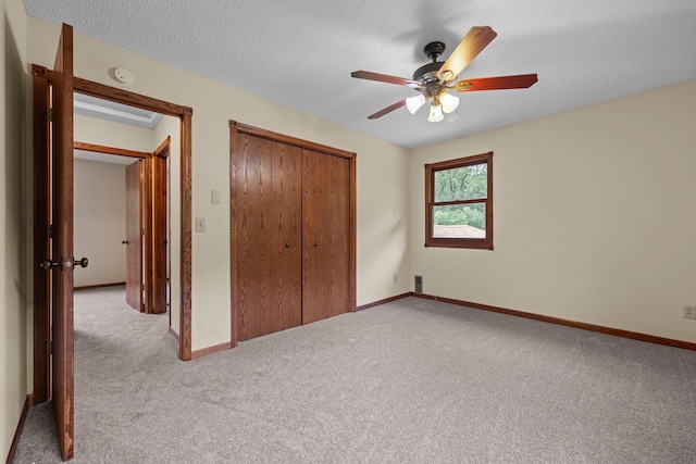 24345 165th St NW, Orrock Twp, MN 55309 - unfurnished bedroom featuring carpet flooring, a closet, ceiling fan, and a textured ceiling