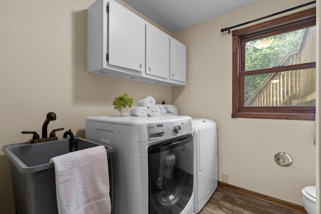 24345 165th St NW, Orrock Twp, MN 55309 - laundry room featuring washing machine and dryer and wood finished floors
