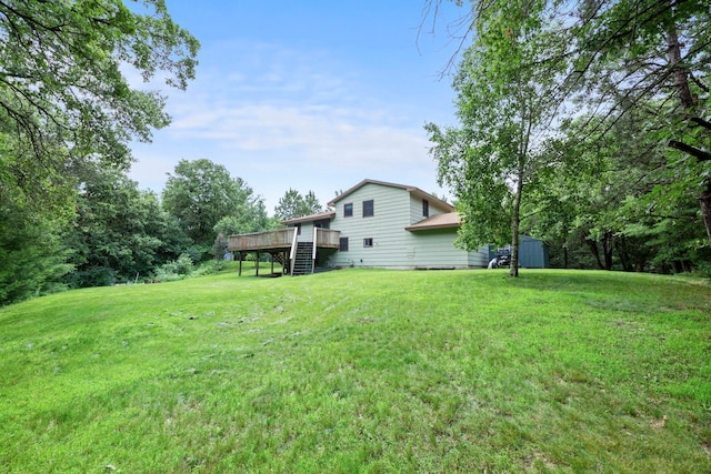 24345 165th St NW, Orrock Twp, MN 55309 - view of grassy yard featuring stairs, a deck, and a storage unit