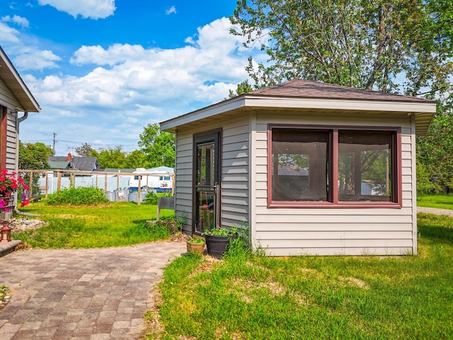 718 22nd St NW, Bemidji, MN 56601 - view of side of property with an outbuilding and a patio area