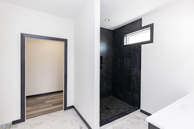 4712 Hampton Loop S, Moorhead, MN 56560 - full bathroom with marble finish flooring, a tile shower, vanity, recessed lighting, and baseboards