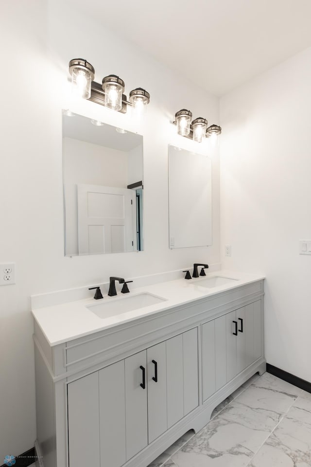 4712 Hampton Loop S, Moorhead, MN 56560 - full bathroom with double vanity, marble look tiles, and baseboards