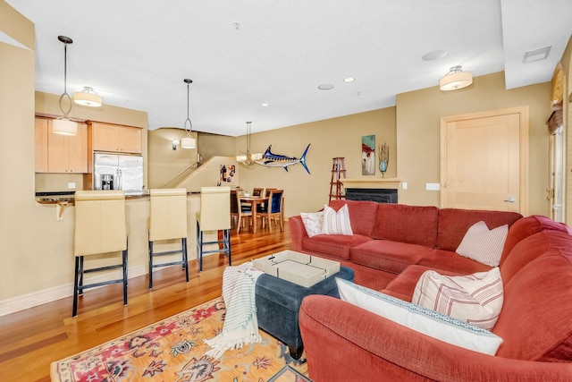 650 Main St N Unit B05, Stillwater, MN 55082 - living area featuring light wood finished floors, recessed lighting, and baseboards
