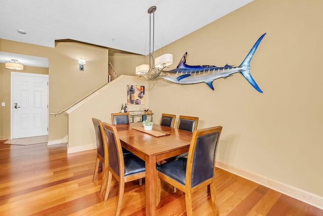 650 Main St N Unit B05, Stillwater, MN 55082 - dining area with light wood-style floors, stairway, and baseboards