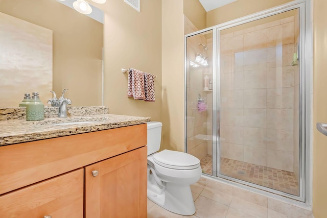 650 Main St N Unit B05, Stillwater, MN 55082 - bathroom with toilet, vanity, a shower stall, and tile patterned floors