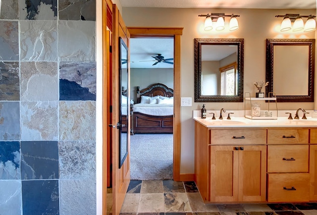 462 Rowena Curv, Elko New Market, MN 55054 - ensuite bathroom featuring double vanity, a ceiling fan, and stone finish floors