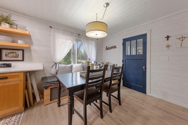 721 1st St N, Waterville, MN 56096 - dining room featuring wood walls, light wood-type flooring, and wooden ceiling