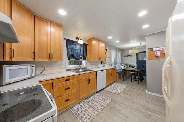 721 1st St N, Waterville, MN 56096 - kitchen with white appliances, wall chimney range hood, a sink, recessed lighting, and light wood-style flooring