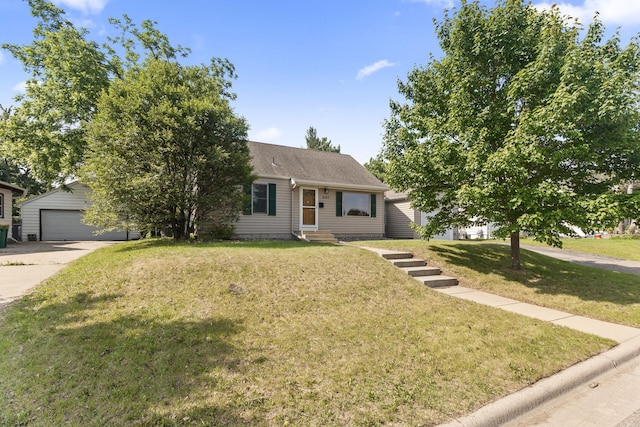 5107 Corvallis Ave N, Crystal, MN 55429 - view of front of home featuring a front lawn, an outbuilding, entry steps, a detached garage, and roof with shingles