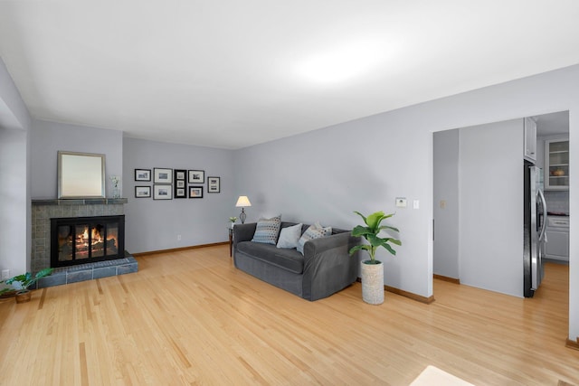 5625 Upton Ave S, Minneapolis, MN 55410 - living room with light wood-style floors and a glass covered fireplace