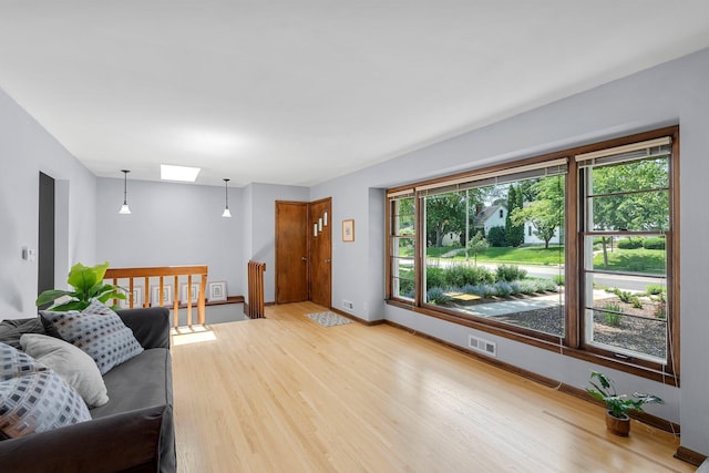 5625 Upton Ave S, Minneapolis, MN 55410 - living area with wood finished floors and a skylight