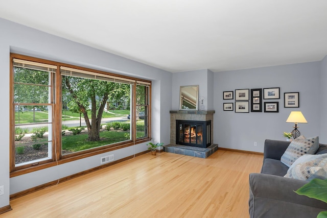 5625 Upton Ave S, Minneapolis, MN 55410 - living area featuring wood finished floors and a tile fireplace