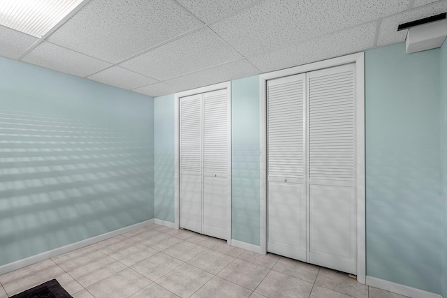 5625 Upton Ave S, Minneapolis, MN 55410 - unfurnished bedroom with a drop ceiling and light tile patterned floors