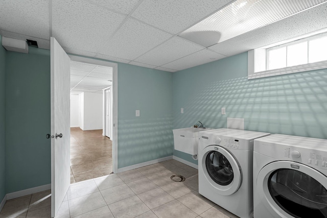 5625 Upton Ave S, Minneapolis, MN 55410 - laundry room featuring washing machine and dryer and light tile patterned floors