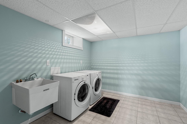 5625 Upton Ave S, Minneapolis, MN 55410 - washroom with washer and clothes dryer and light tile patterned flooring