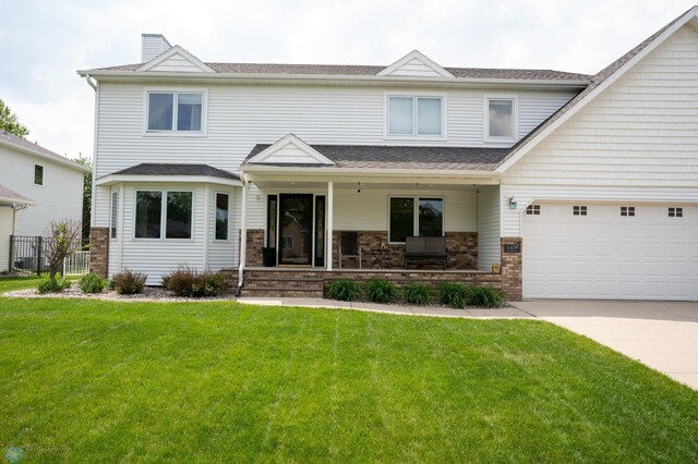 4408 Riverwood Dr N, Fargo, ND 58102 - view of front of property featuring a porch, driveway, brick siding, a chimney, and roof with shingles